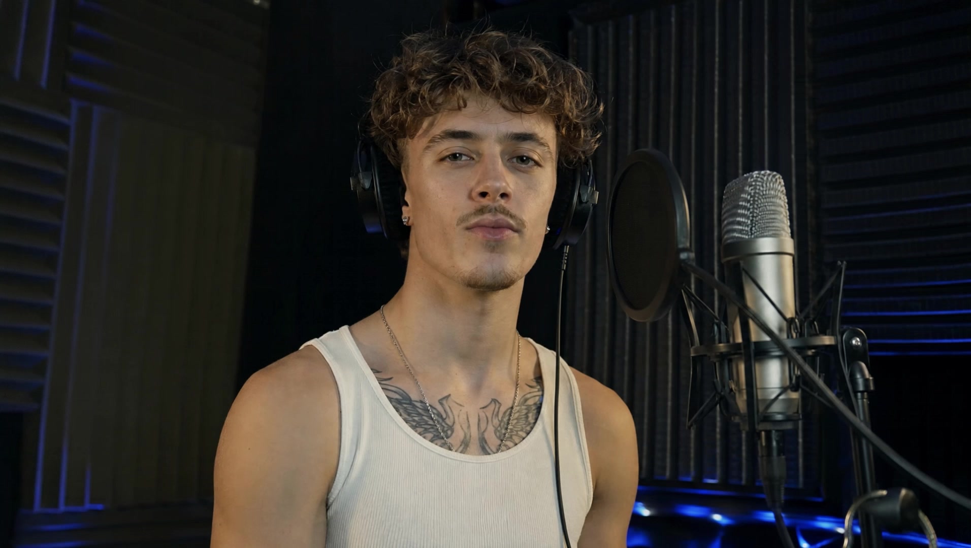 Vocalist beside a studio microphone